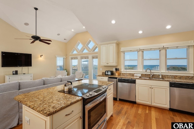 5001 S Virginia Dare Trl Lot 25, Nags Head, NC 27959 - kitchen with appliances with stainless steel finishes, a sink, cream cabinetry, open floor plan, and light stone counters