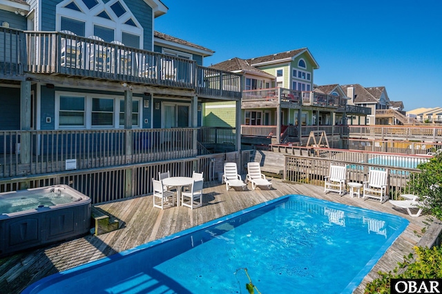 5001 S Virginia Dare Trl Lot 25, Nags Head, NC 27959 - view of pool featuring a hot tub, a deck, and a residential view
