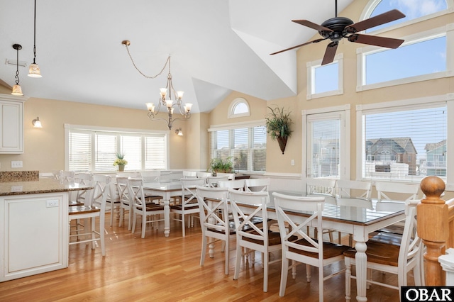 5001 S Virginia Dare Trl Lot 25, Nags Head, NC 27959 - dining room featuring light wood-style flooring, healthy amount of natural light, a chandelier, a ceiling fan, and high vaulted ceiling