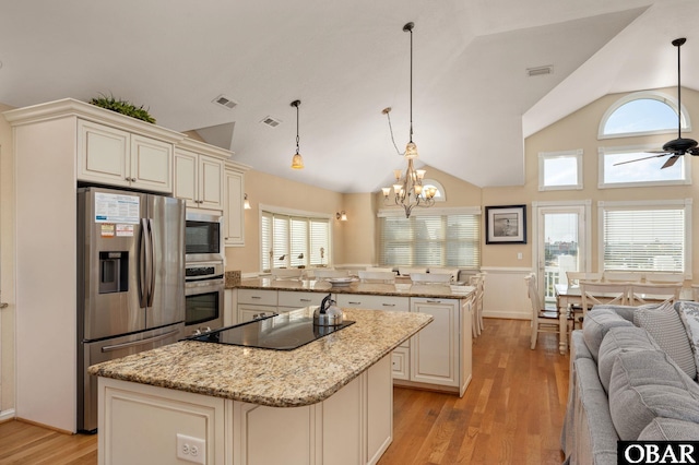 5001 S Virginia Dare Trl Lot 25, Nags Head, NC 27959 - kitchen featuring appliances with stainless steel finishes, a center island, open floor plan, light wood finished floors, and ceiling fan