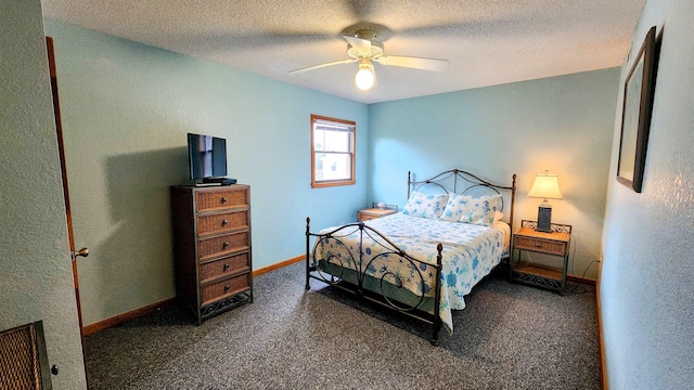 bedroom with ceiling fan, baseboards, and a textured ceiling