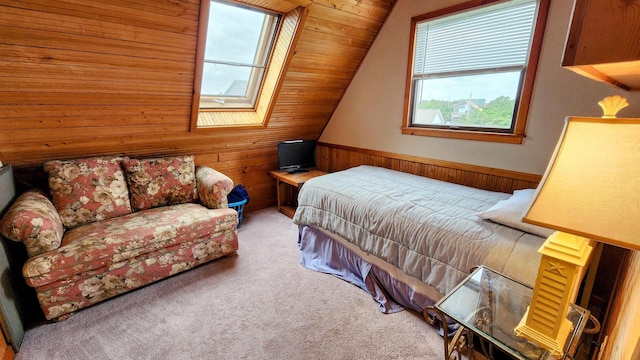 bedroom featuring lofted ceiling, wainscoting, carpet flooring, and wood walls