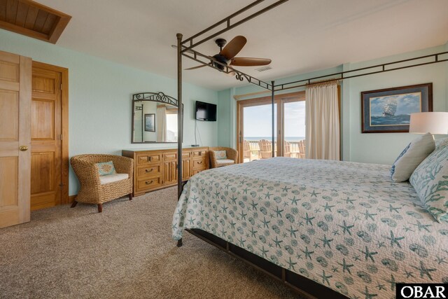 bedroom with ceiling fan, access to outside, carpet flooring, and visible vents