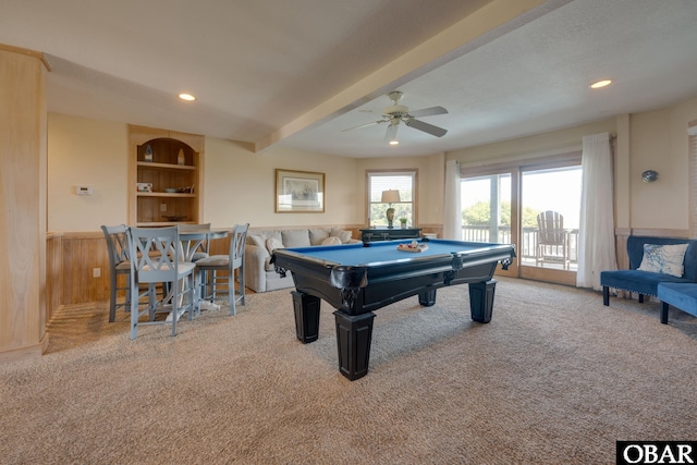 playroom with light carpet, built in features, a wainscoted wall, beamed ceiling, and pool table