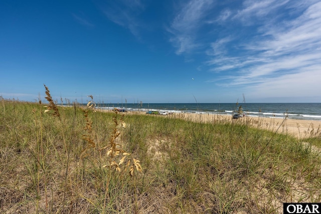 property view of water featuring a beach view