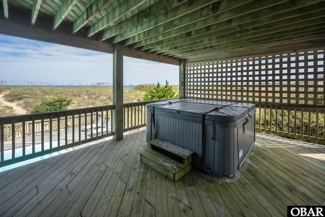 wooden terrace with a hot tub