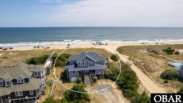 aerial view featuring a water view and a view of the beach