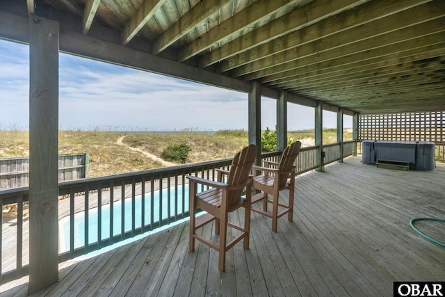 deck featuring a fenced in pool