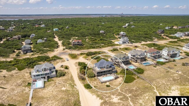 bird's eye view featuring a forest view