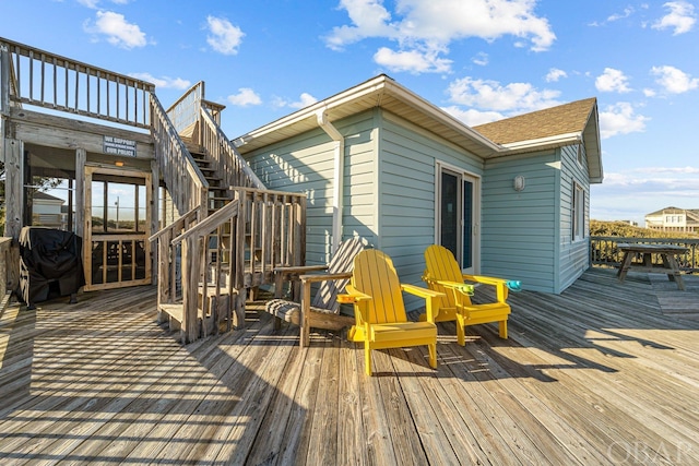 wooden terrace featuring stairway