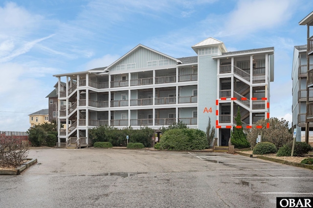 view of property with uncovered parking