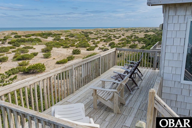 wooden deck with a water view