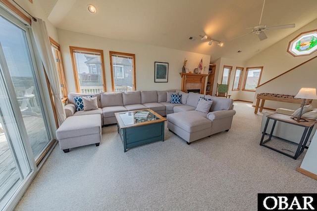 living area featuring lofted ceiling, a ceiling fan, carpet flooring, and recessed lighting