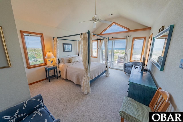 bedroom featuring vaulted ceiling, carpet, and multiple windows