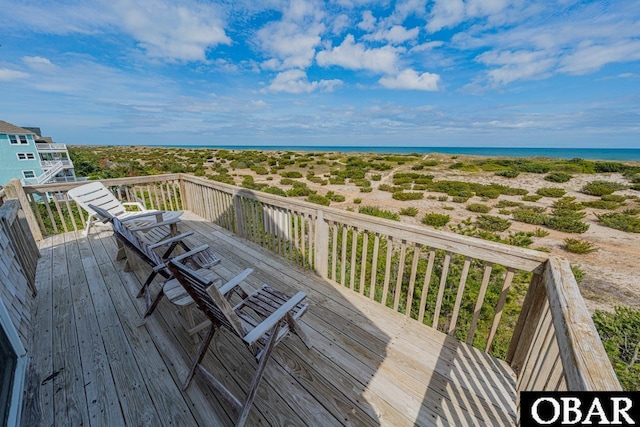 wooden deck with a water view