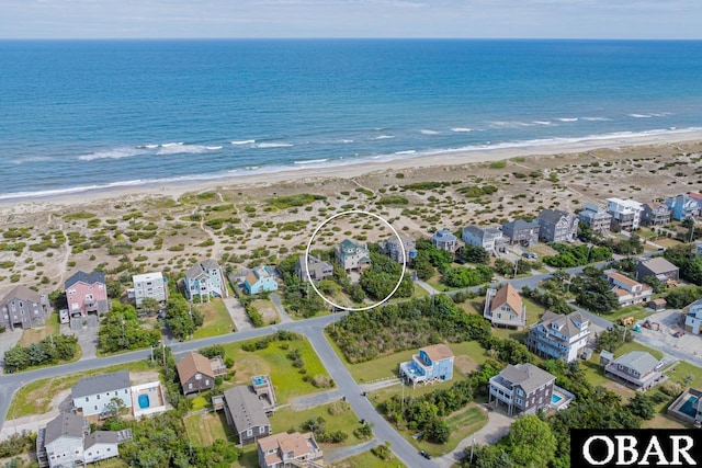 drone / aerial view with a view of the beach and a water view