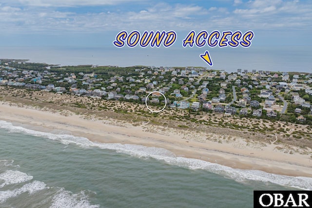 aerial view with a beach view and a water view