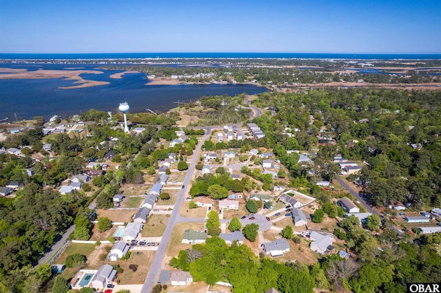 drone / aerial view featuring a water view and a residential view