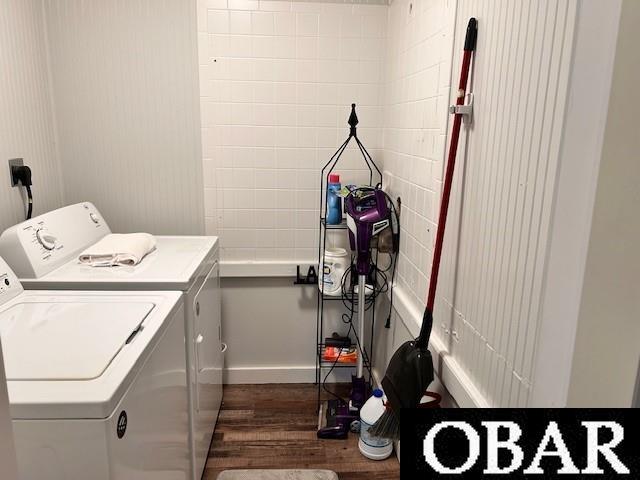 690 Irvin Garrish Hwy Lot # 2A, Ocracoke, NC 27960 - laundry area featuring washer and clothes dryer and dark wood-style flooring