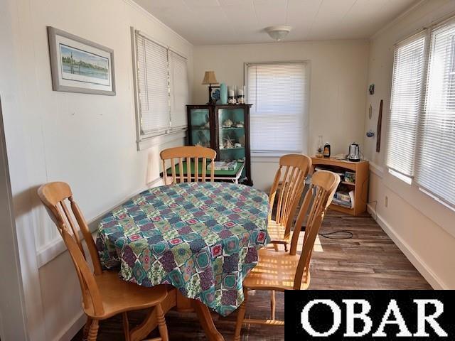 690 Irvin Garrish Hwy Lot # 2A, Ocracoke, NC 27960 - dining room with healthy amount of natural light, wood finished floors, and baseboards