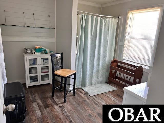 690 Irvin Garrish Hwy Lot # 2A, Ocracoke, NC 27960 - full bath featuring wood finished floors, ornamental molding, healthy amount of natural light, and a shower with shower curtain