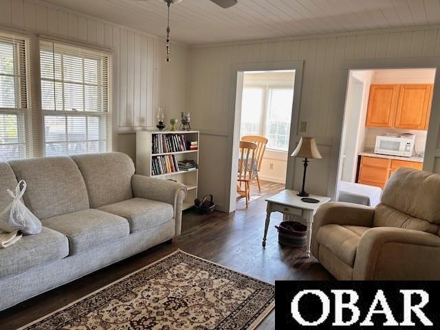 690 Irvin Garrish Hwy Lot # 2A, Ocracoke, NC 27960 - living room with dark wood-style flooring, ceiling fan, and ornamental molding