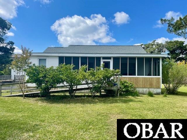 690 Irvin Garrish Hwy Lot # 2A, Ocracoke, NC 27960 - back of property featuring a sunroom and a yard