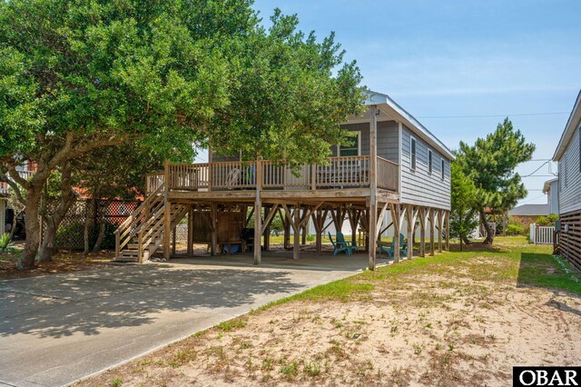 111 Carlow Ave Lot 18, Kill Devil Hills, NC 27948 - beach home featuring a carport, stairway, and concrete driveway