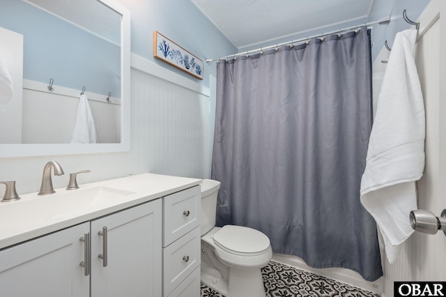 111 Carlow Ave Lot 18, Kill Devil Hills, NC 27948 - bathroom featuring vanity, toilet, tile patterned floors, and shower / bath combo with shower curtain