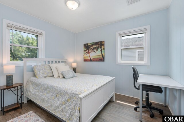 111 Carlow Ave Lot 18, Kill Devil Hills, NC 27948 - bedroom featuring wood finished floors, multiple windows, an office area, and baseboards