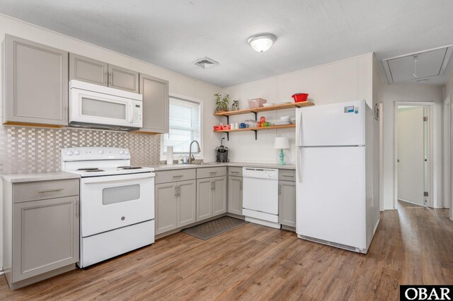 111 Carlow Ave Lot 18, Kill Devil Hills, NC 27948 - kitchen featuring white appliances, light wood-type flooring, a sink, and gray cabinets