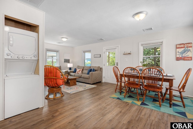 111 Carlow Ave Lot 18, Kill Devil Hills, NC 27948 - dining area featuring estacked washer and dryer, wood finished floors, and plenty of natural light