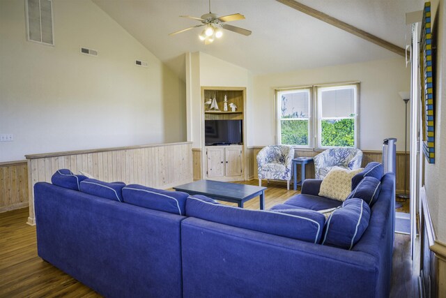 living area featuring wainscoting, visible vents, and dark wood finished floors