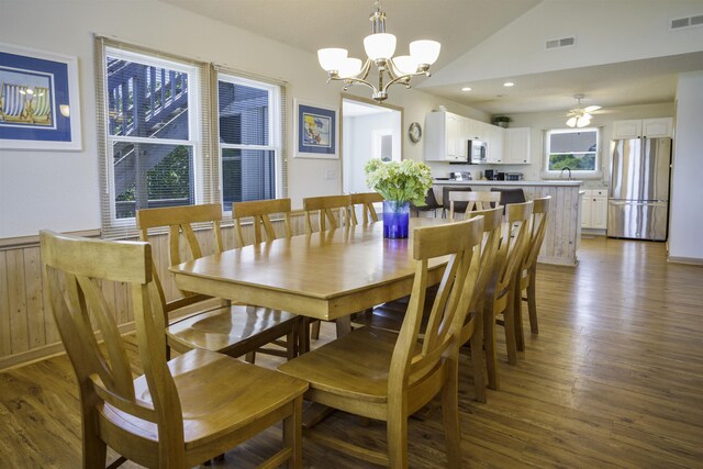 dining area featuring vaulted ceiling, dark wood-style flooring, visible vents, and recessed lighting