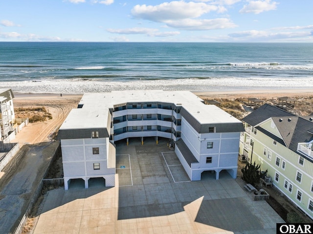 aerial view featuring a view of the beach and a water view