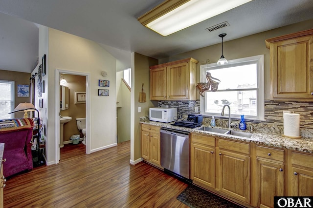 50059 Blackbeards Ct Lot # 166, Frisco, NC 27936 - kitchen with stainless steel dishwasher, white microwave, dark wood-style flooring, decorative backsplash, and vaulted ceiling