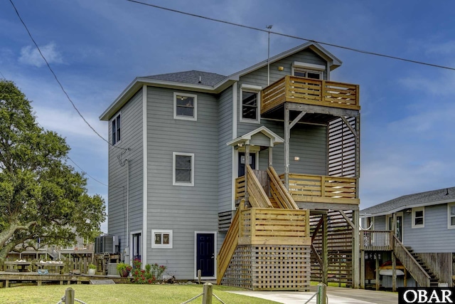 50059 Blackbeards Ct Lot # 166, Frisco, NC 27936 - view of front facade with stairway, a balcony, and a front yard