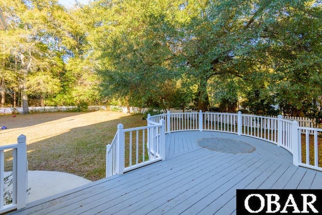 wooden terrace featuring a lawn