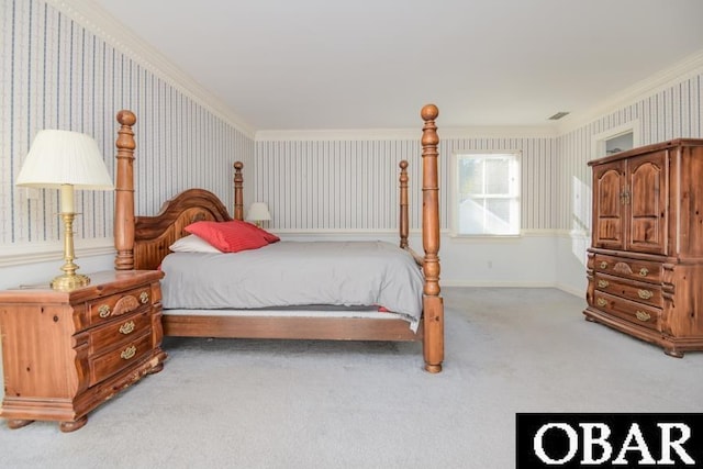 bedroom featuring carpet, visible vents, baseboards, and wallpapered walls