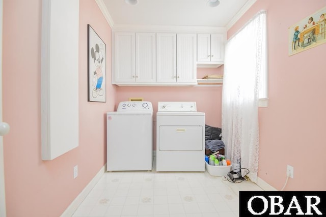 laundry area with ornamental molding, independent washer and dryer, cabinet space, and baseboards