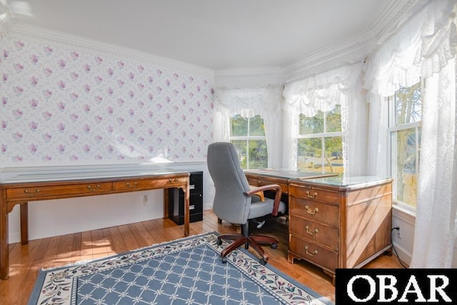 office space featuring ornamental molding, light wood finished floors, wainscoting, and wallpapered walls