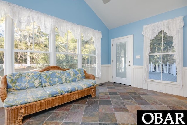 sunroom / solarium with vaulted ceiling, visible vents, and a wealth of natural light