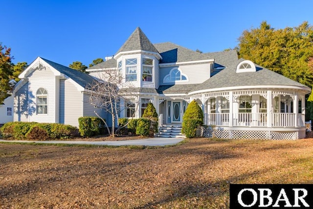 victorian-style house featuring a porch