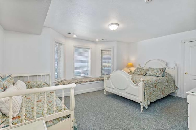 bedroom with recessed lighting, baseboards, and carpet flooring