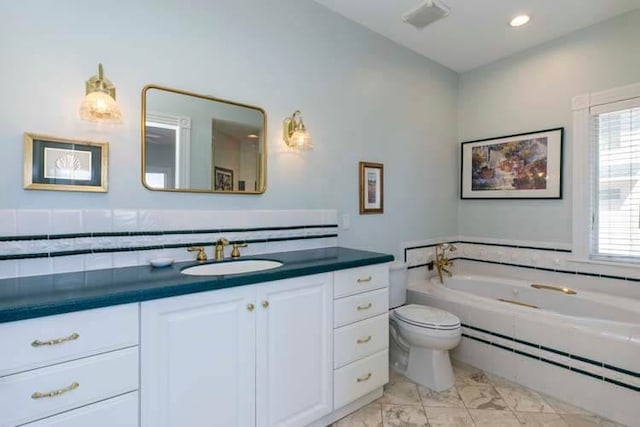 full bath with vanity, visible vents, a garden tub, toilet, and marble finish floor