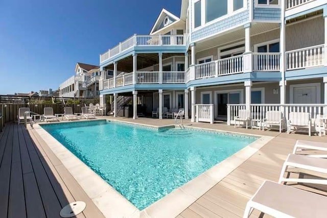 view of swimming pool with a fenced in pool and a patio