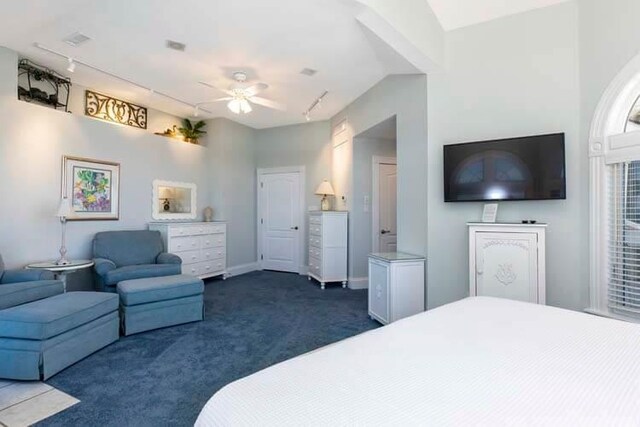 bedroom with a ceiling fan, visible vents, baseboards, track lighting, and dark colored carpet