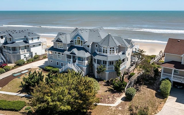 bird's eye view featuring a view of the beach and a water view