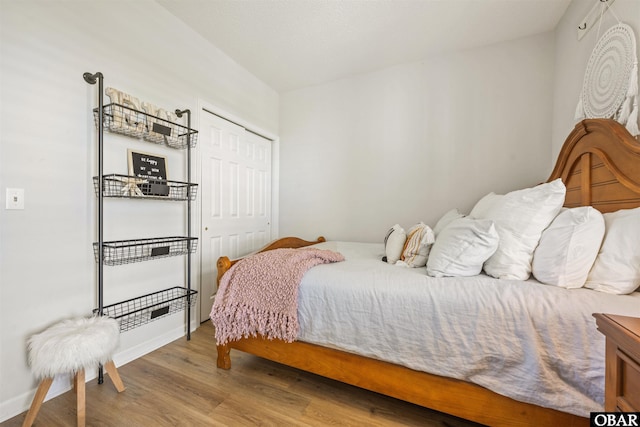 1113 Pirates Way Unit 1113, Manteo, NC 27954 - bedroom with wood finished floors, a closet, and baseboards