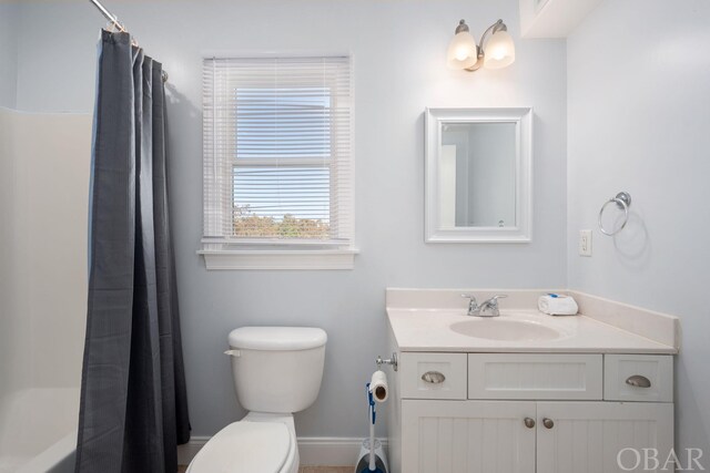 bathroom with toilet and vanity